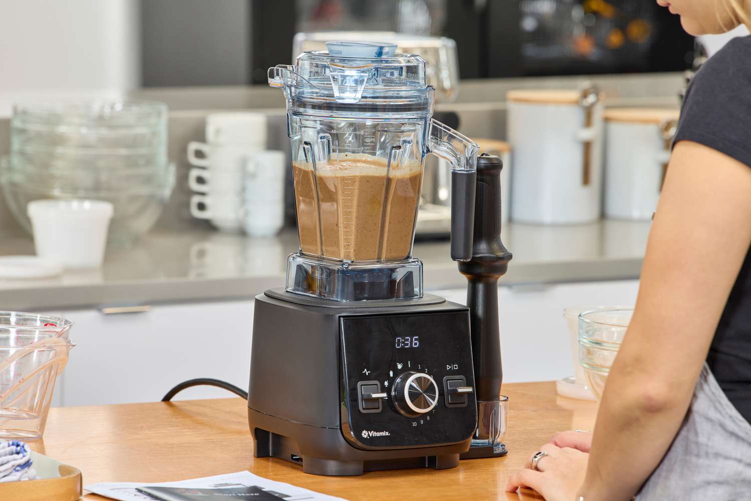 A person watching the Vitamix Ascent X2 on a counter