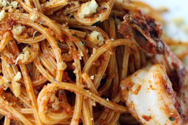 Closeup of Red Pistou Pasta with Shrimp and Crunchy Herbes de Provence Crumbs.