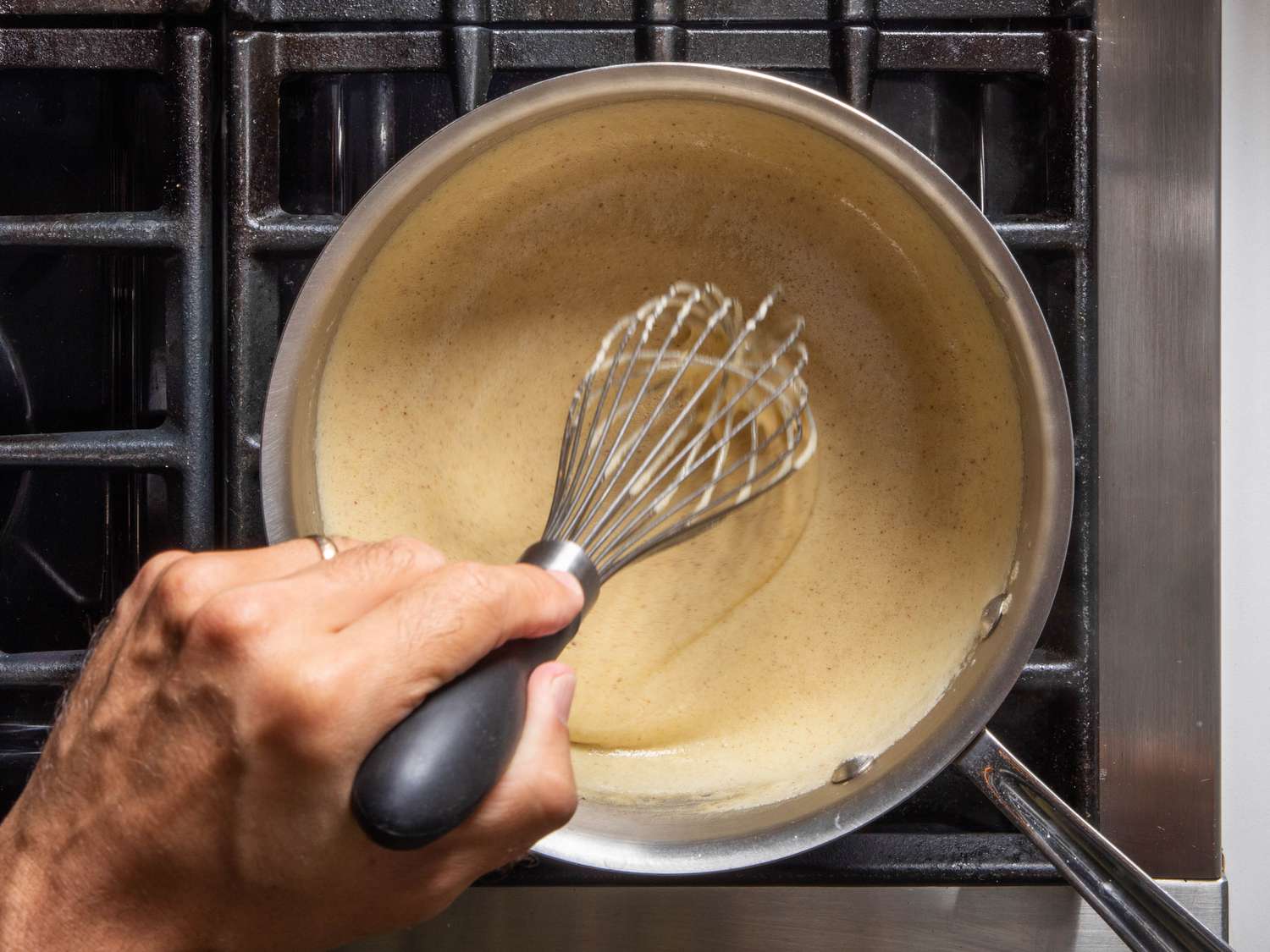 Gelatin being whisked into custard mixture for pumpkin chiffon pie