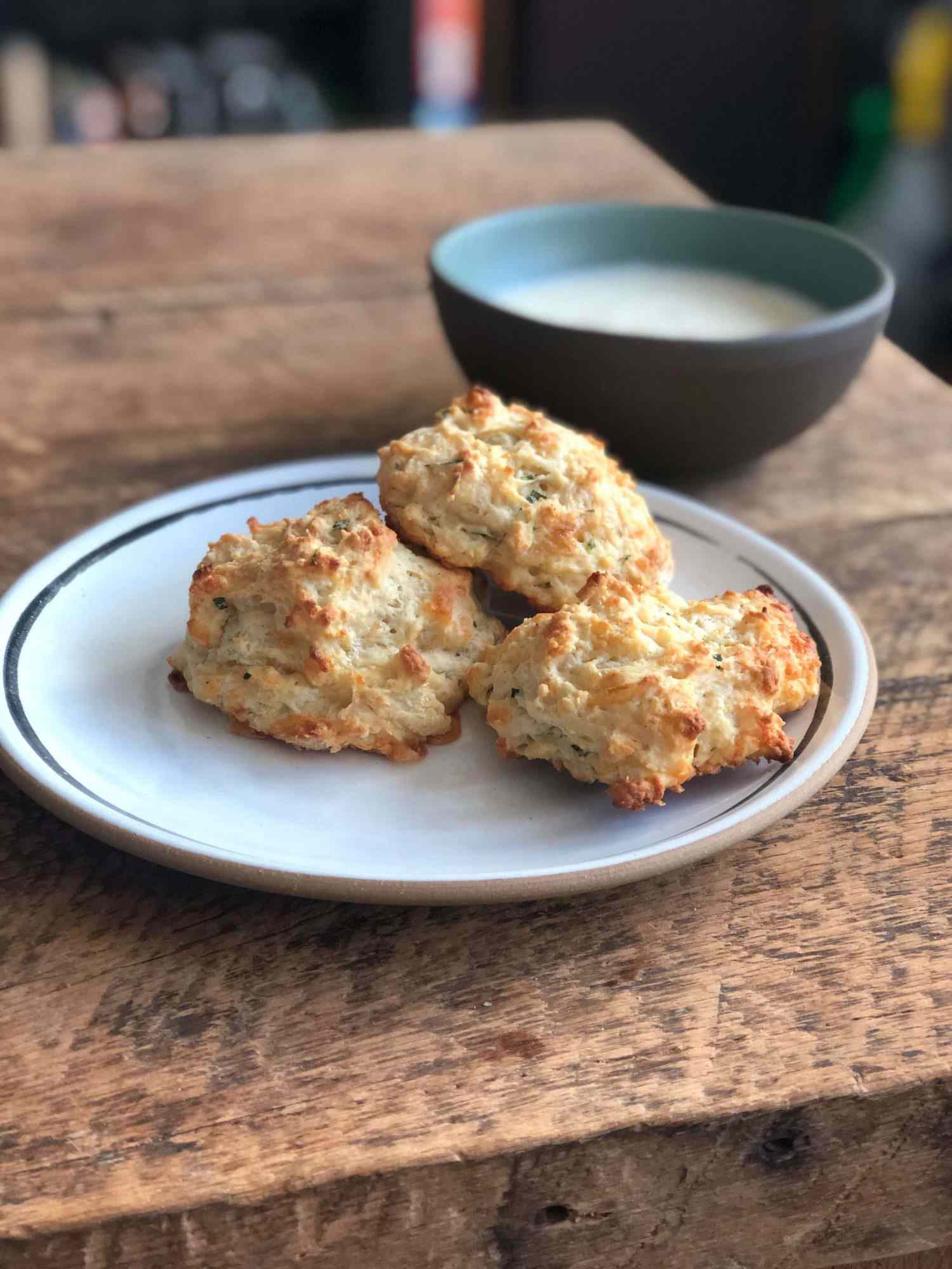 Plate of cheddar drop biscuits on a table