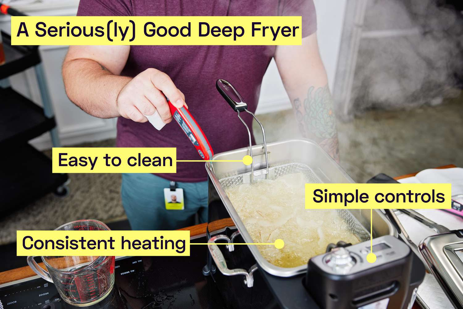 A person frying potato chips in a deep fryer.