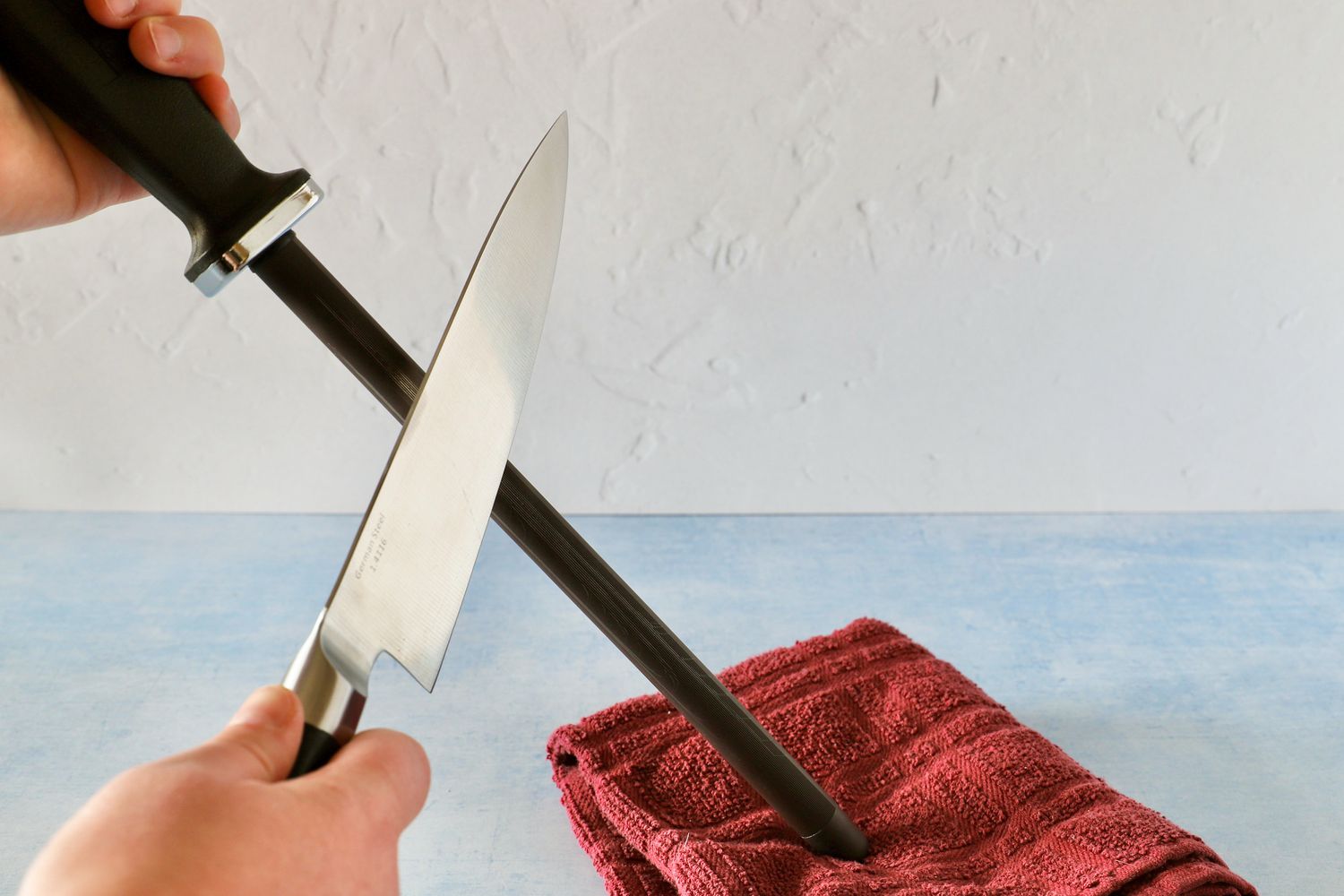 using a honing rod to hone a chef's knife