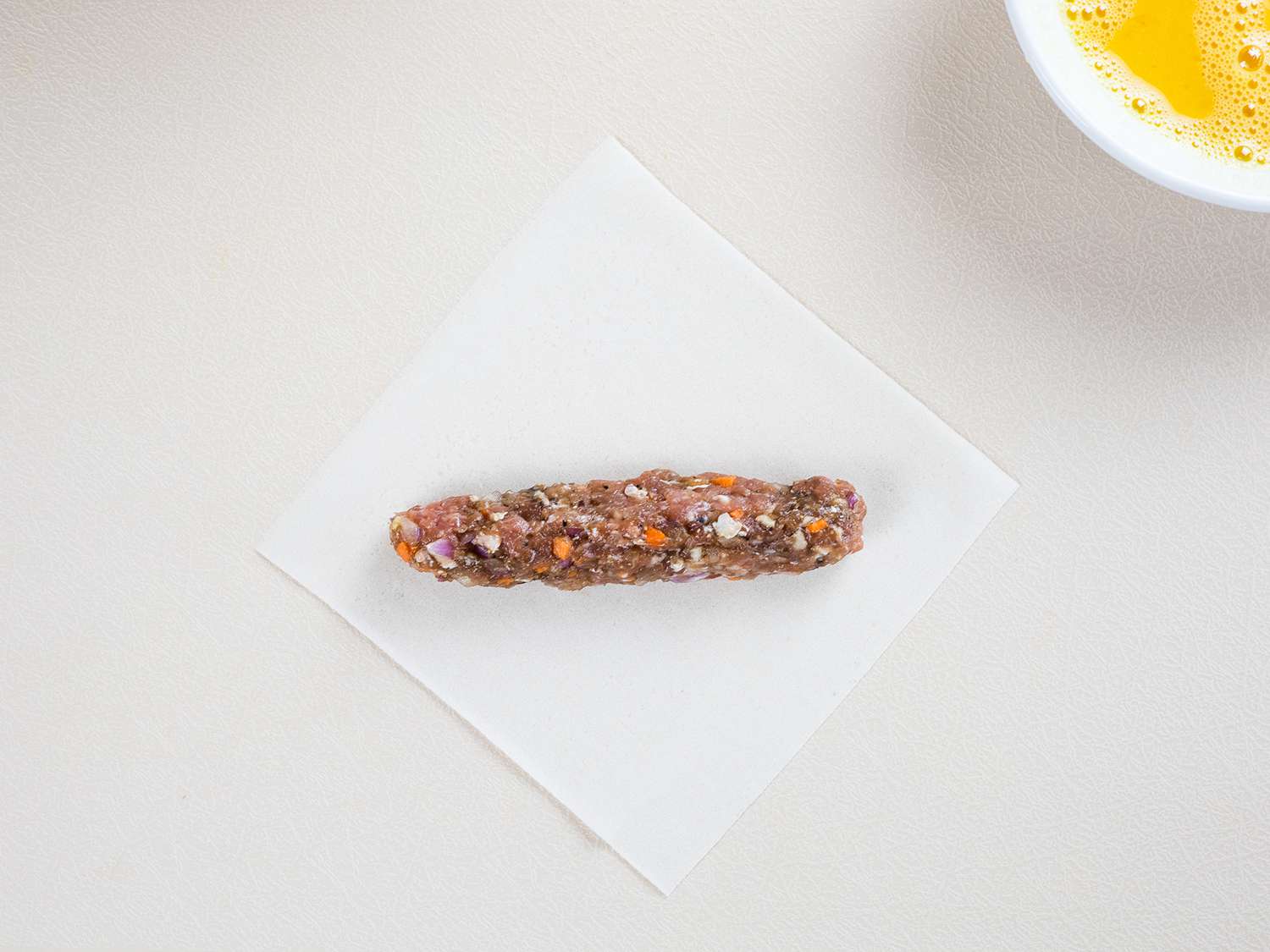 adding filling to wrapper