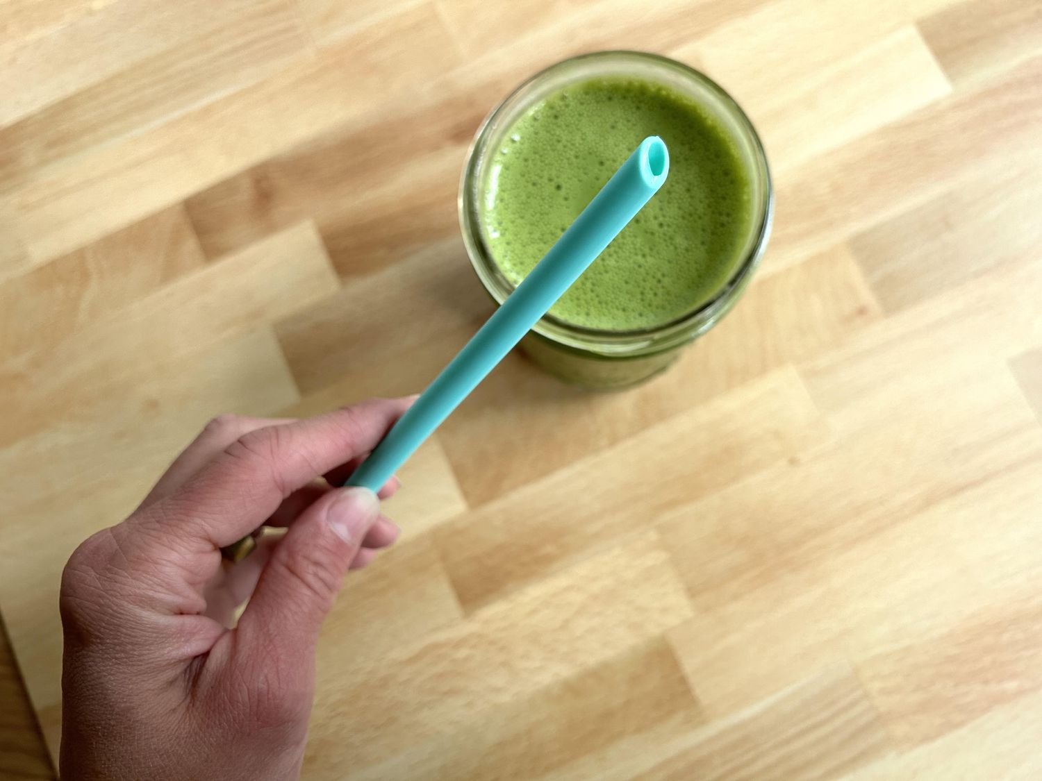 The bottom of a reusable silicone straw 