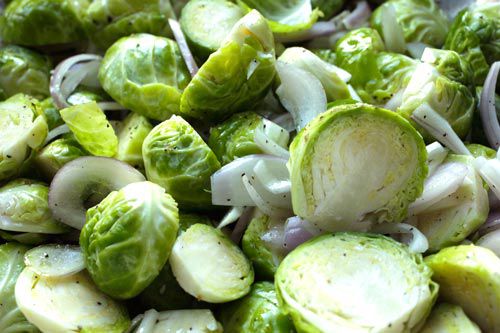 Tray of sliced raw Brussels sprouts and shallots