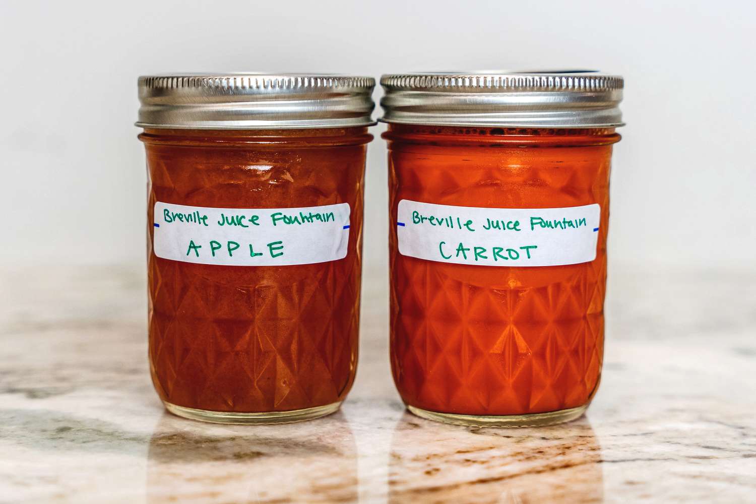 Two mason jars of juice