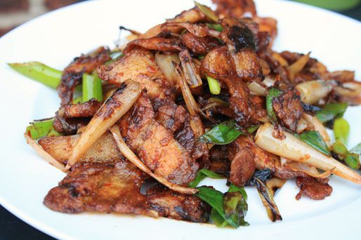 A wider shot of twice-cooked pork on a plate.