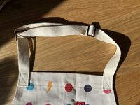 A closeup of the adjustable neck strap on the Hedley & Bennett kids apron.