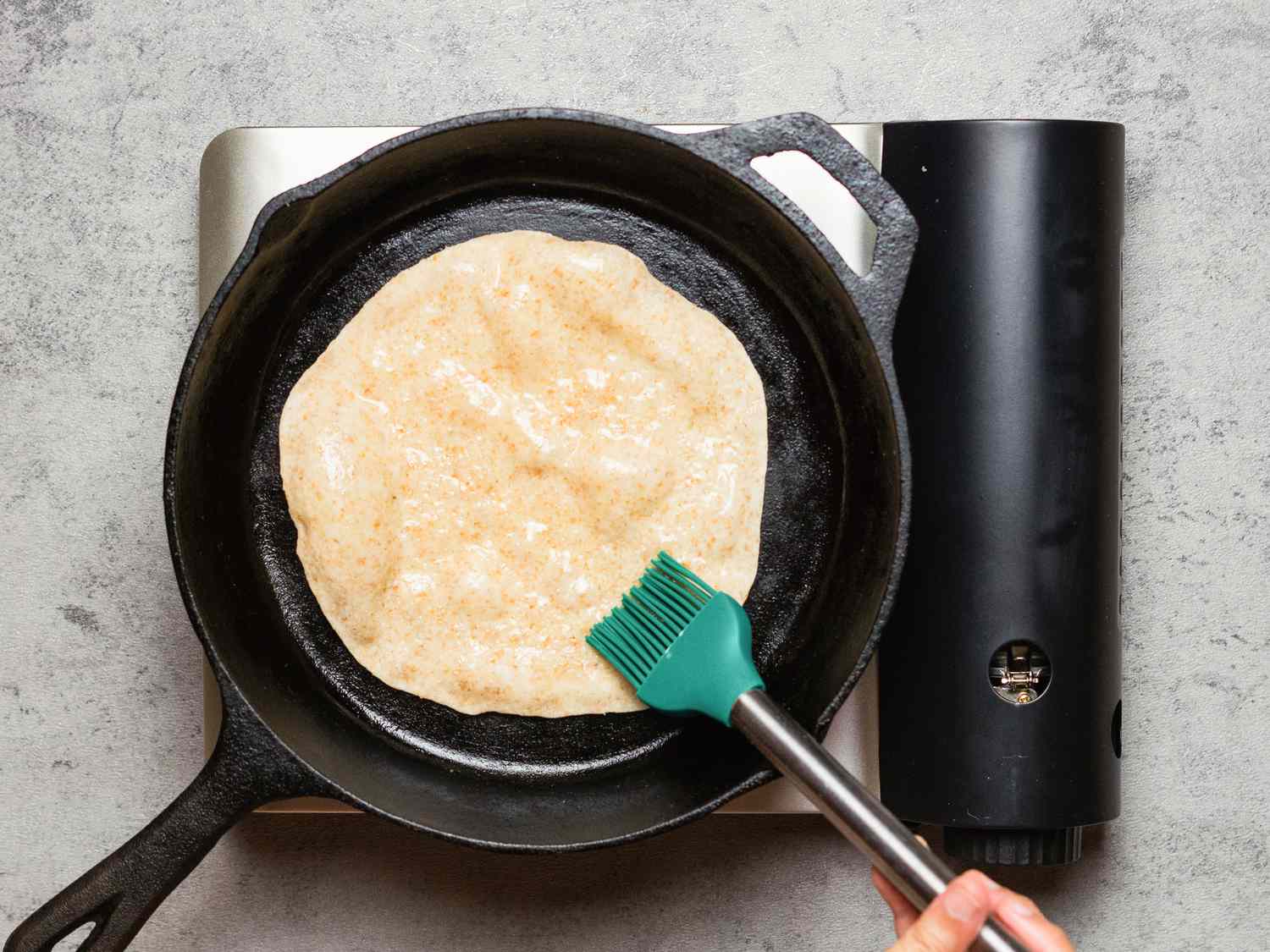 Overhead view of chapati in pan