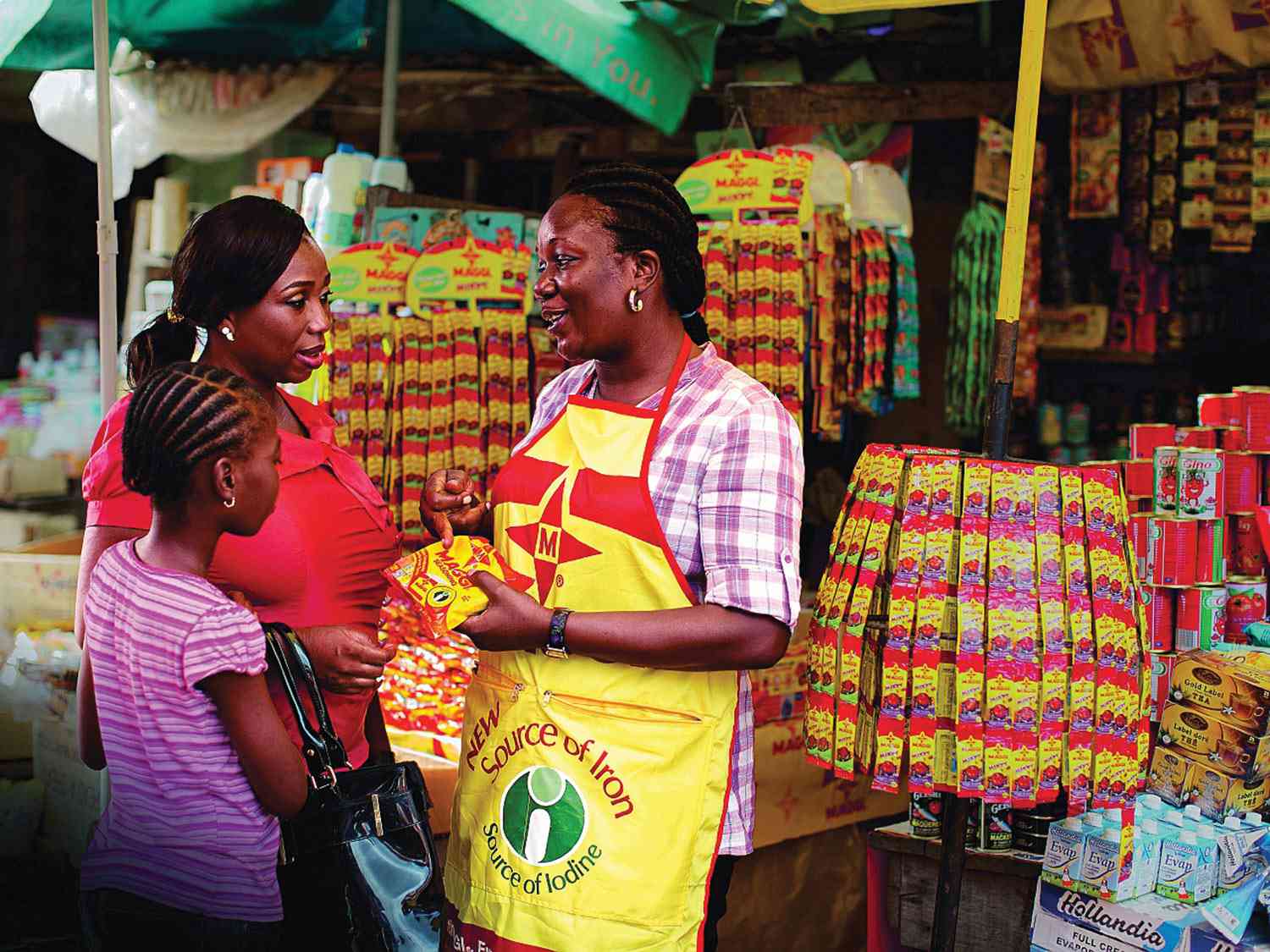 Selling fortified Maggi cubes, Nigeria Iron and iodine-fortified Maggi cubes on sale in an open market in Nigeria, helping address micronutrient deficiency.
