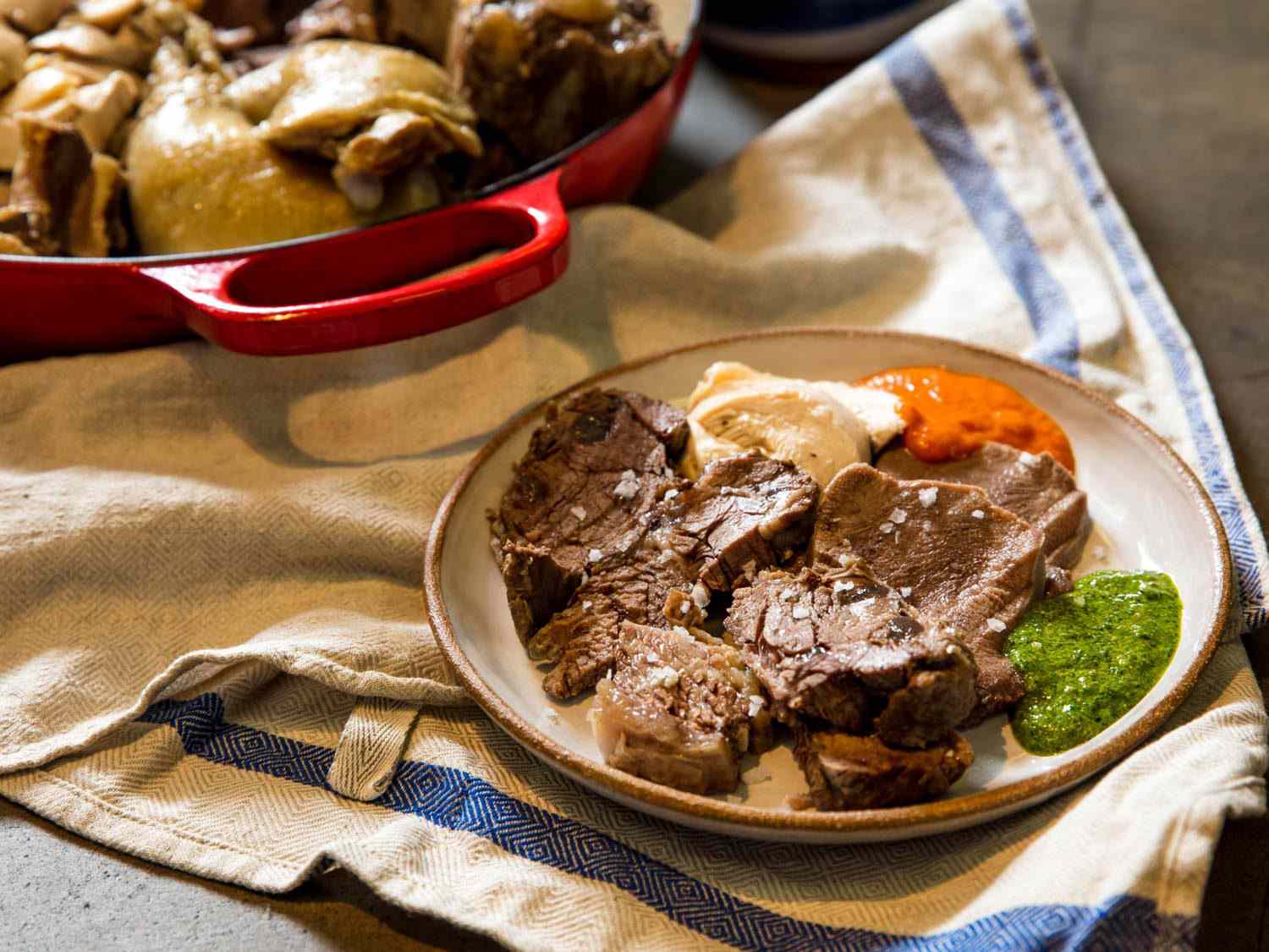 bollito misto plated with salsa verde and salsa rossa