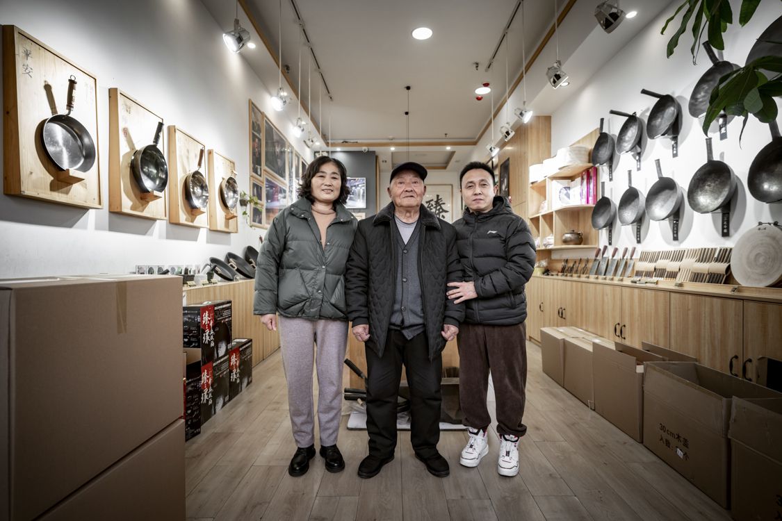 The Wang family stands in the showroom of Zhen San Huan Factory Store