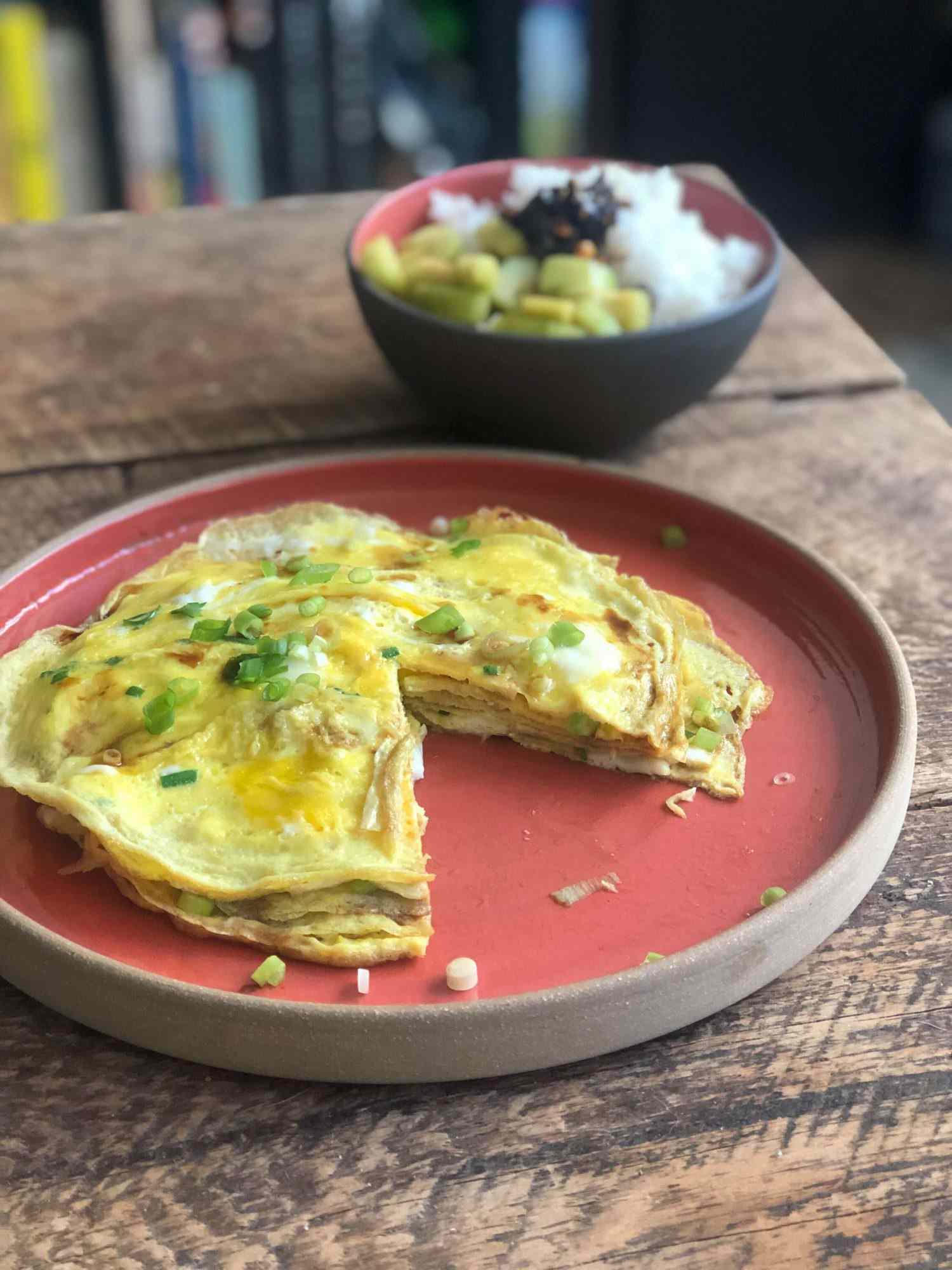 Layered scallion omelet on a plate