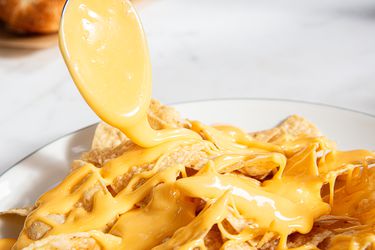 Alka-Seltzer cheese sauce atop nachos.