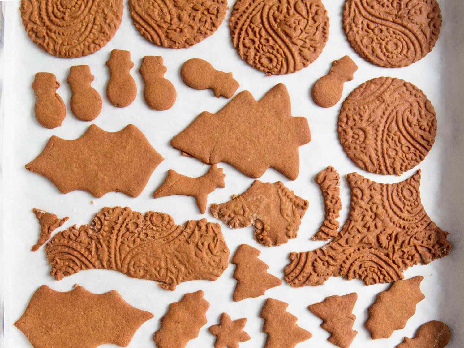 Gingerbread cookie dough scraps on a baking tray. 