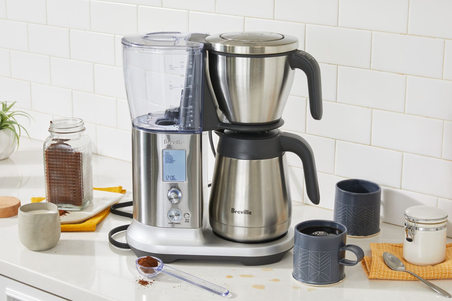 Breville Precision Brewer Thermal Coffee Maker displayed on kitchen counter next to mugs