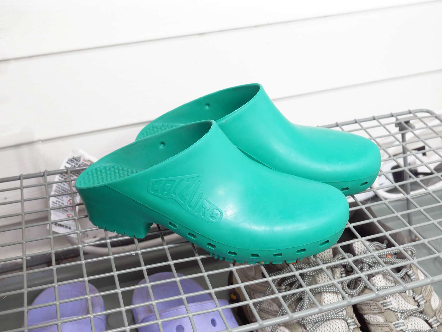 A pair of turquoise Calzuro clogs.