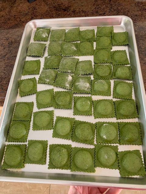 overhead view of tray of spinach ravioli