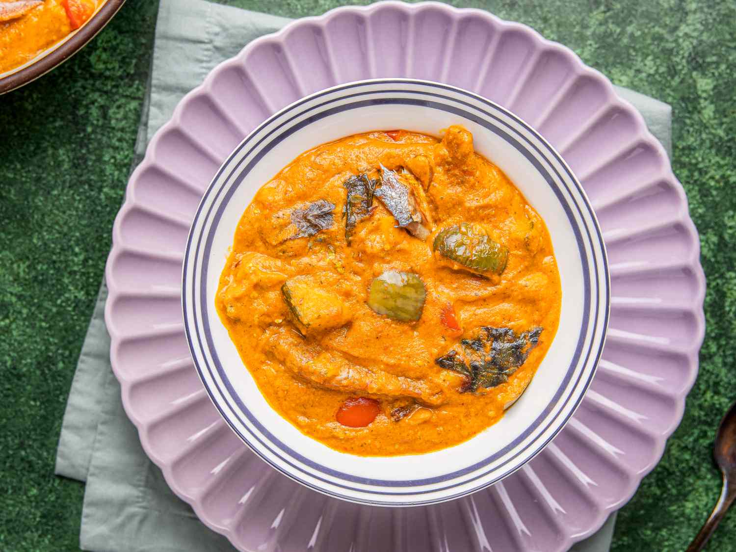 A dish of Nigerian egg sauce served in a bowl on a decorative plate