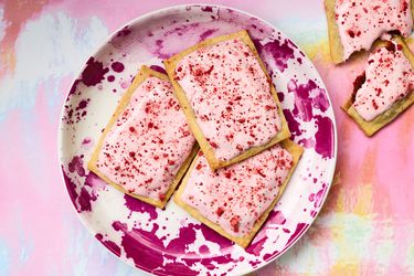 Plate of strawberry rhubarb pop-tarts on a colorful background