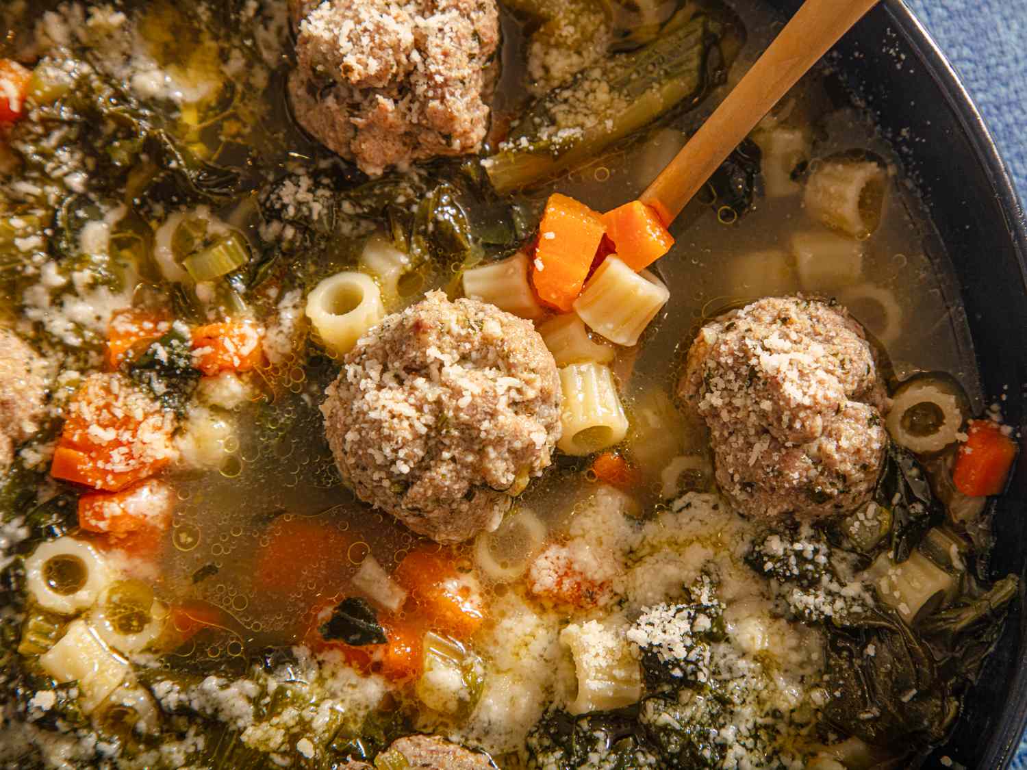 Italian wedding soup in a bowl with vegetables and meatballs