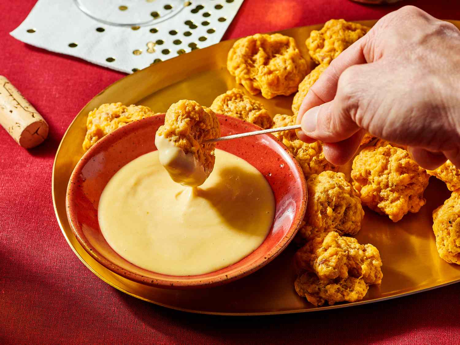 Overhead view of picking up sausage balls