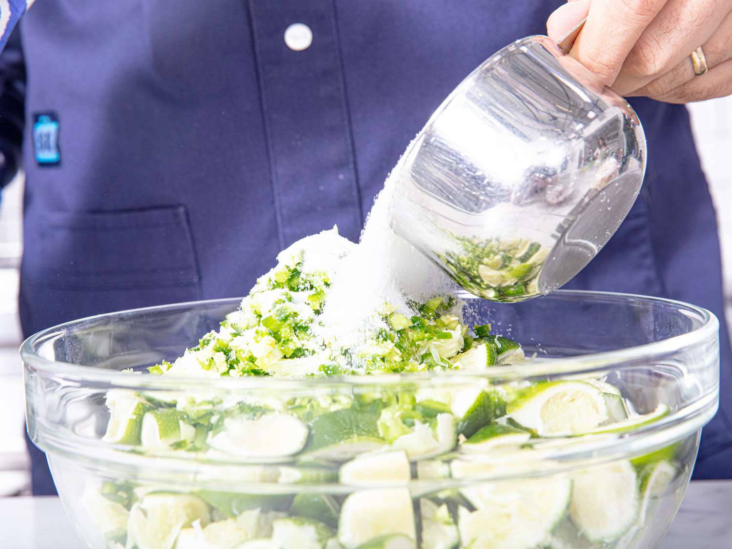 side view of adding sugar to lime mixture