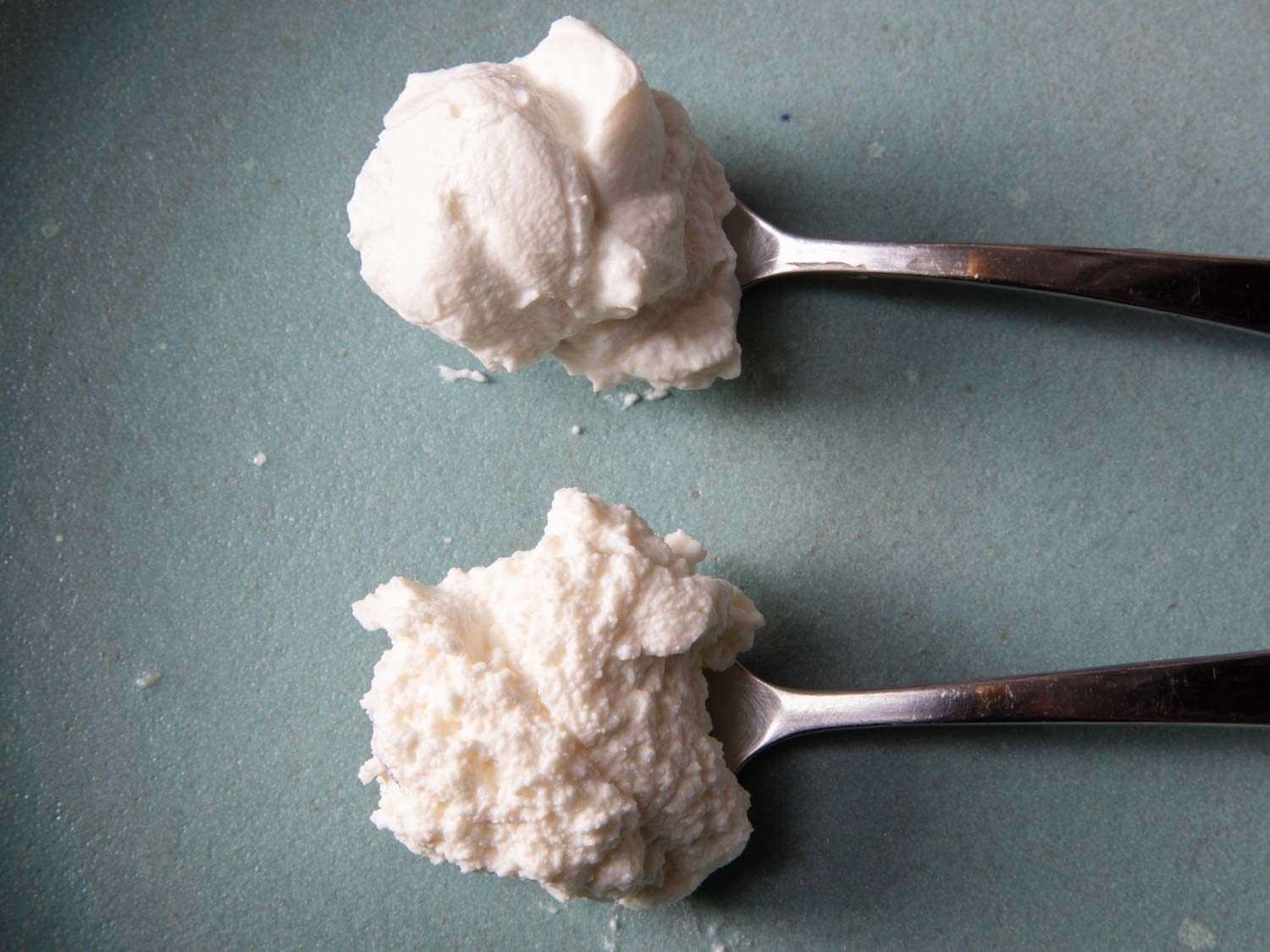 Side by side comparison of two ricotta styles, one grainy and coarse, the other creamy and smooth.
