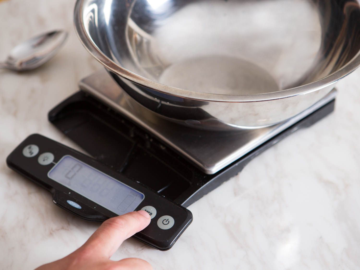 A scale is tared with a mixing bowl.