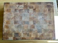An overhead shot of a dried-out wooden cutting board