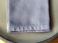 Close-up of a cloth napkin's stitching