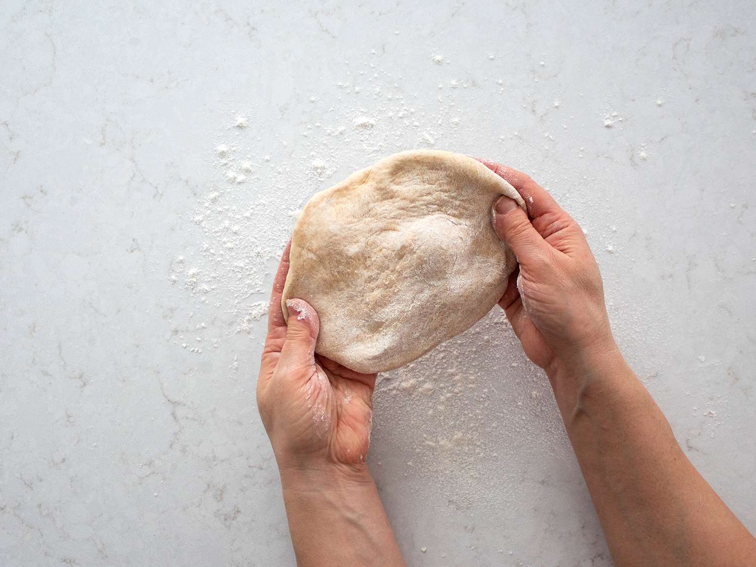 Taboon dough stretched into a 4-inch circle.