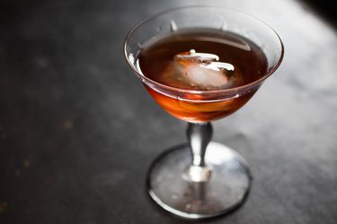 A Blonde Redhead cocktail served over ice in a stemmed cocktail glass