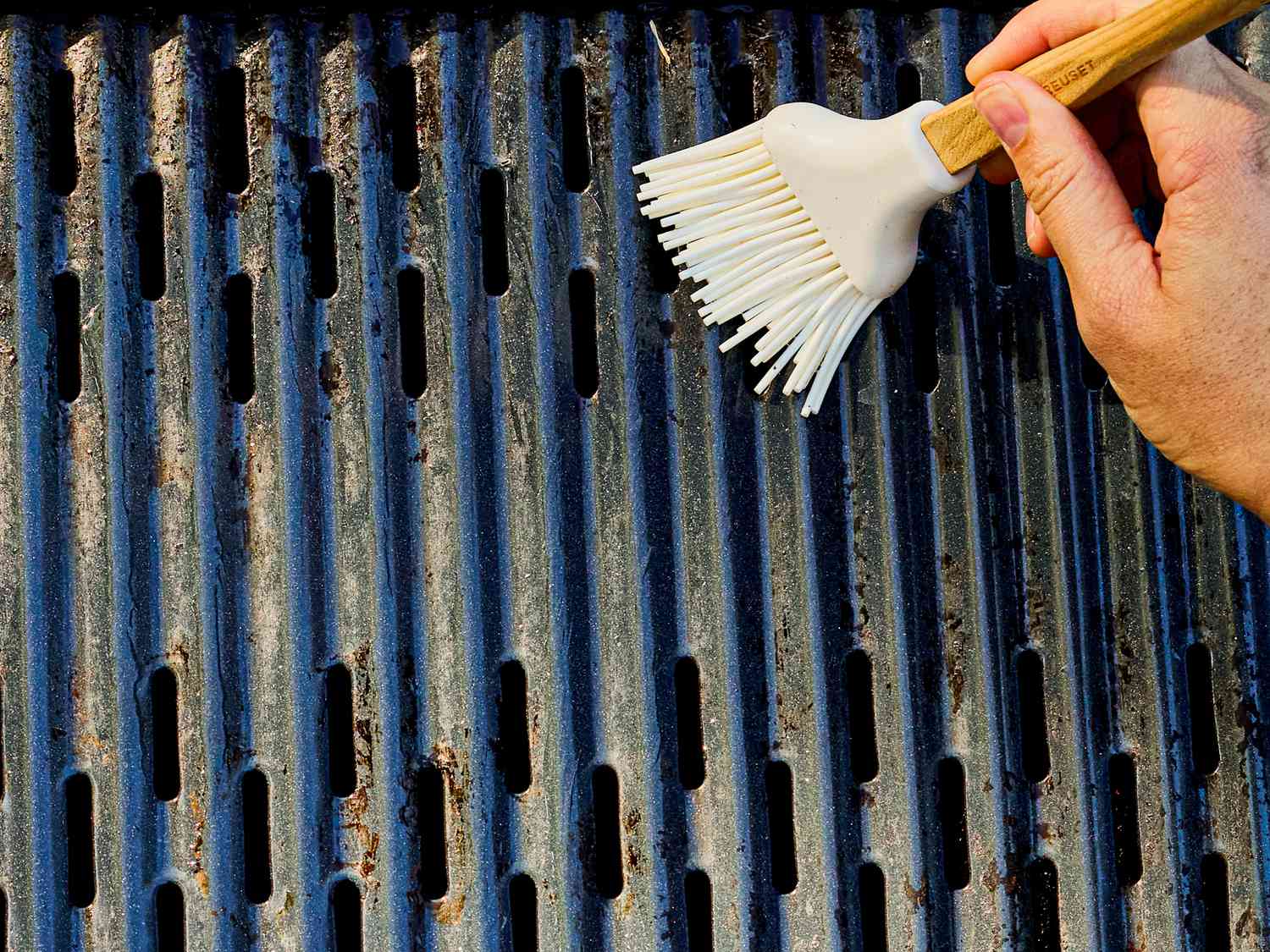 Two image collage of oiling grill