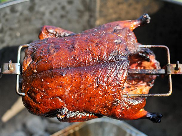 Closeup of the smoked duck on the spit, ready to remove and serve.