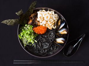 Seafood ramen with squid ink, mussels, and salmon roe