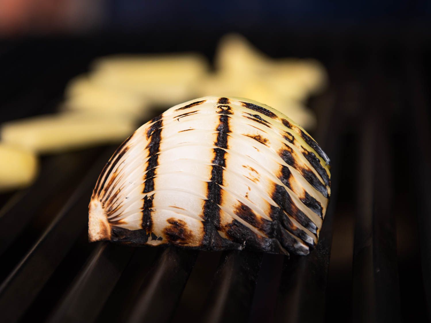 Charred onion on grill for khao piak sen.