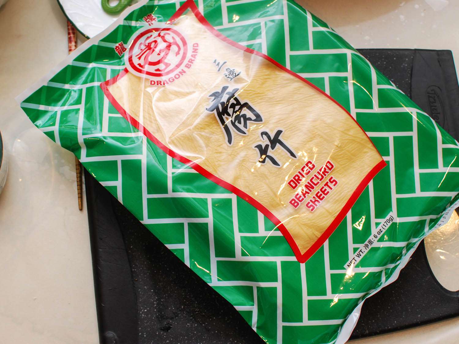 A retail package of dried bean curd skin sheets.