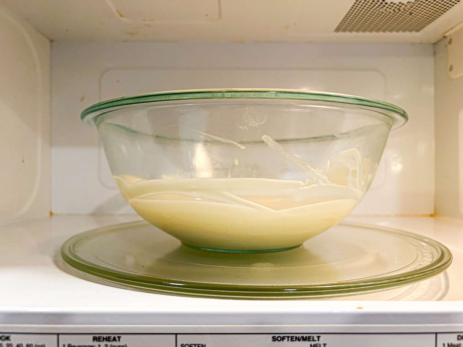 Bowl of chocolate melting in a microwave oven
