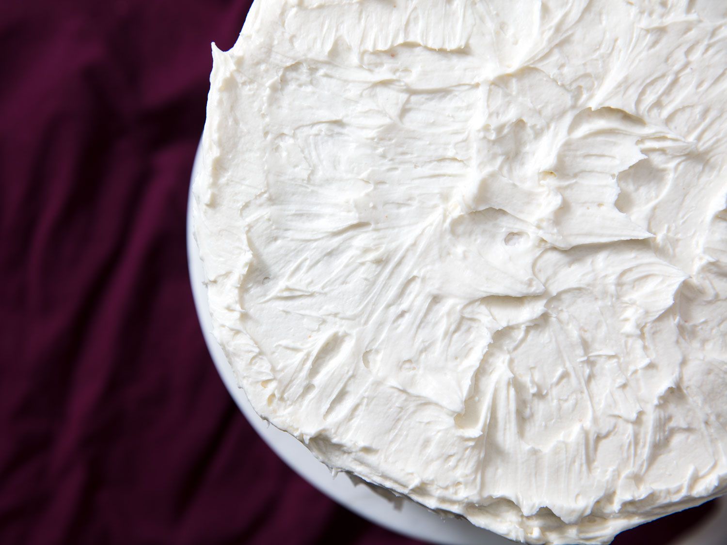 Overhead close-up of a cake frosted with flour frosting.