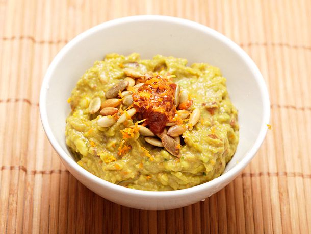 Closeup of Chipotle-Orange Guacamole With Toasted Pumpkin Seeds.