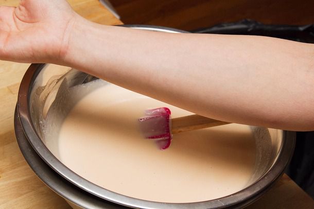 Comparing the color of ice cream base to the color if a pale human arm.