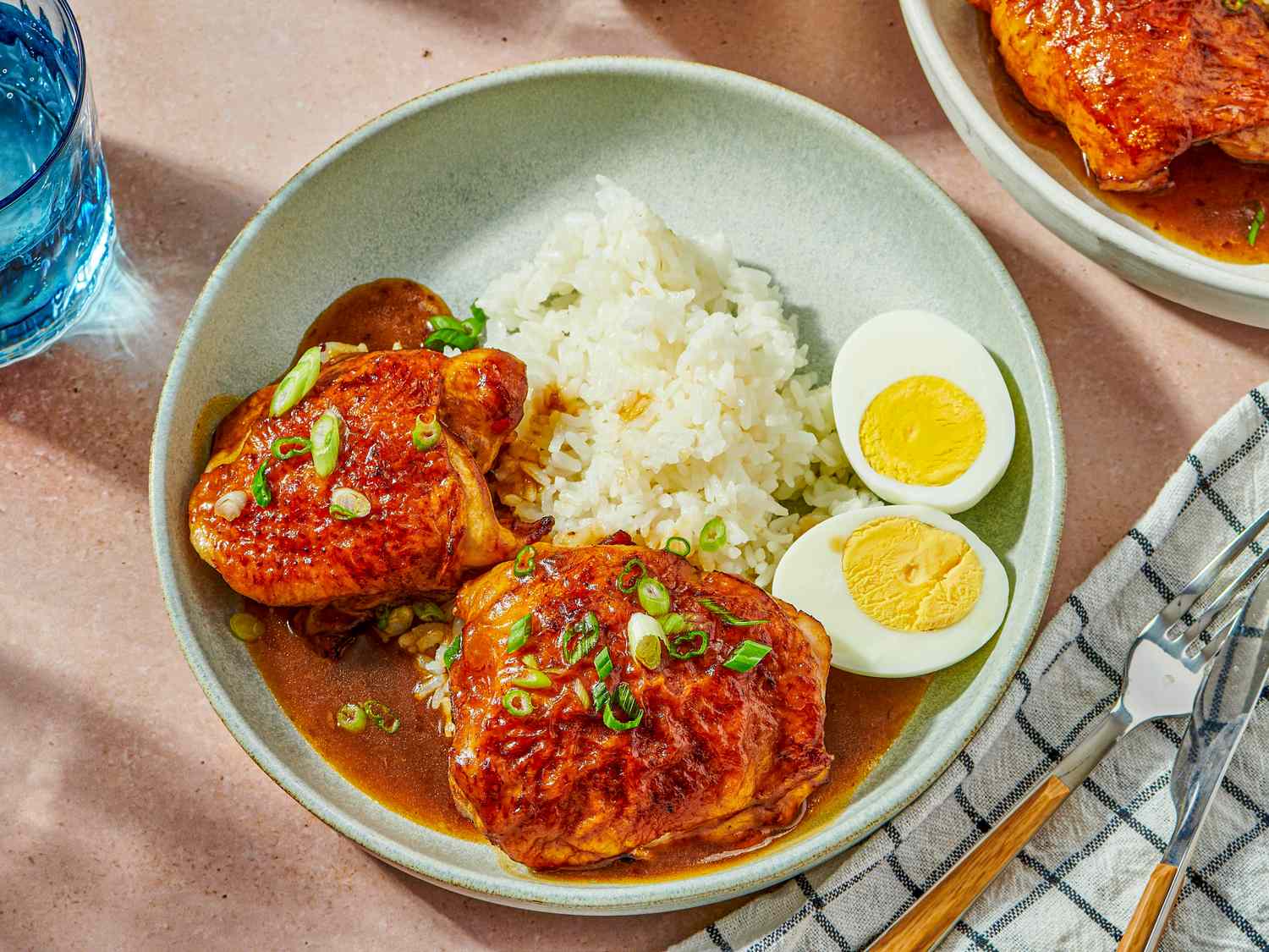 Soy and sesame roast chicken served with rice and boiled eggs