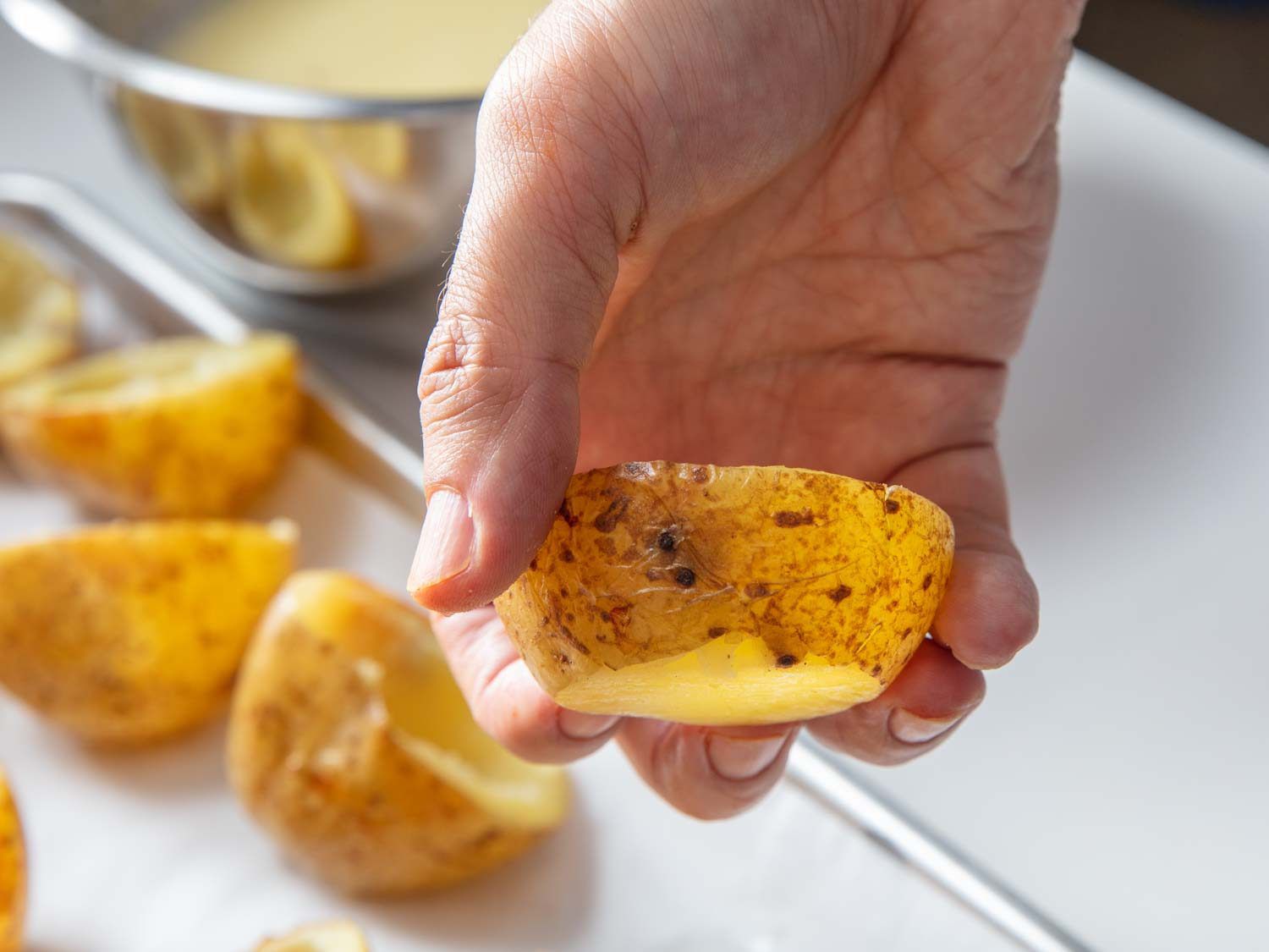 If you want your potato skin cups to sit flat, you can level off their bottoms, as shown in the example in this photo.