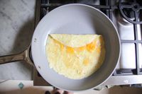 Food cooking in the Caraway Nonstick Ceramic Frying Pan