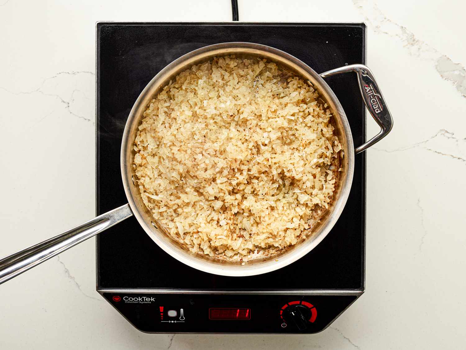 Overhead view of onions in pot