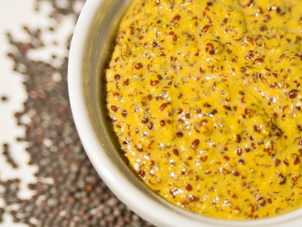 Spicy brown mustard in a ramekin 