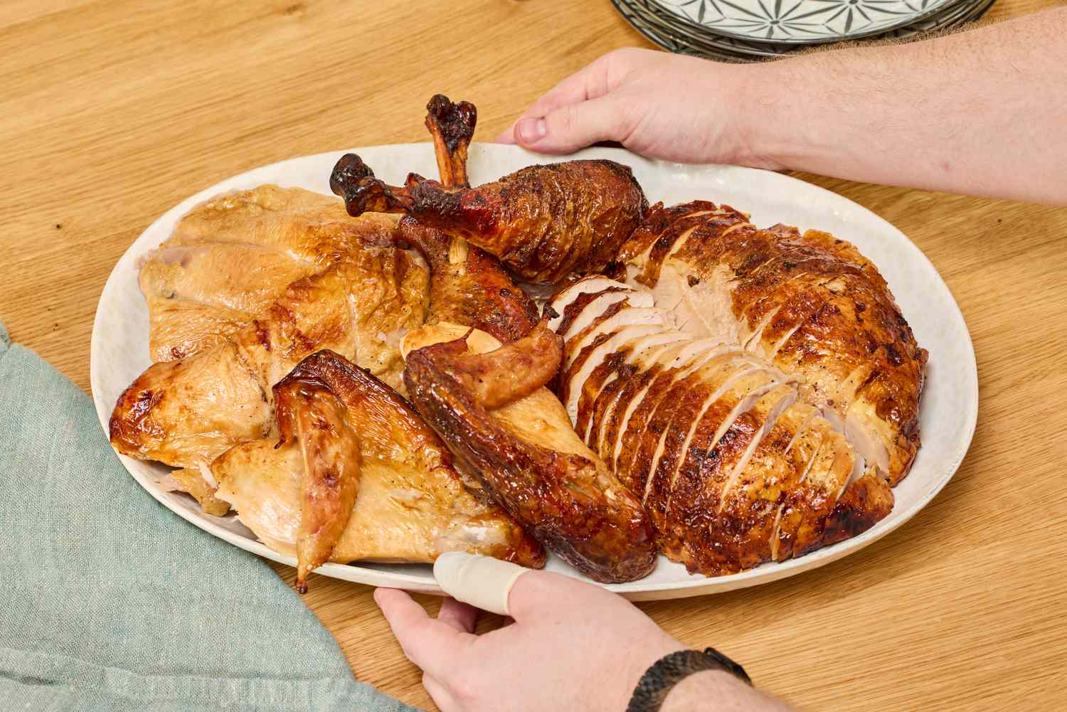 A cut up Omaha Steaks Whole Basted Turkey on a serving platter