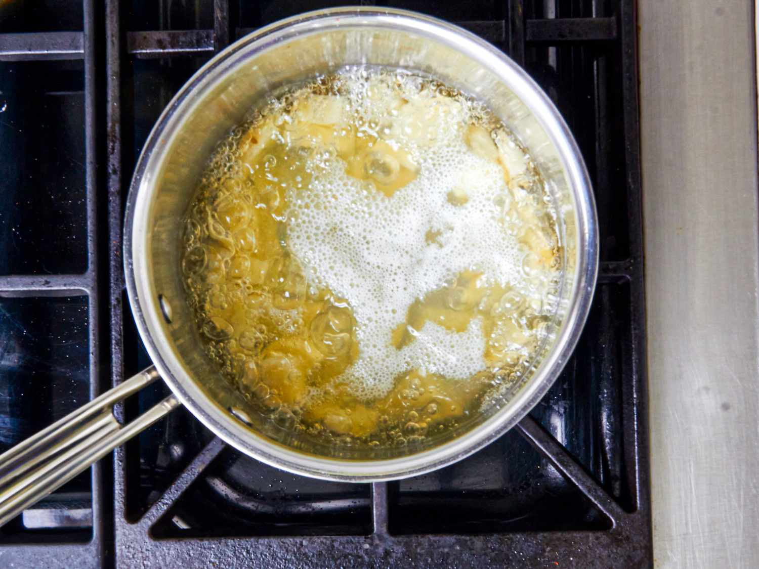 Overhead view of potatoes boiling