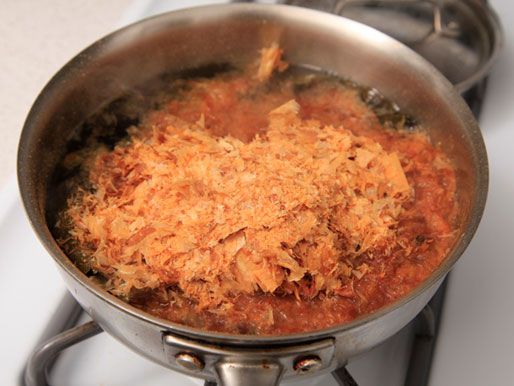 A pot of niban dashi for miso soup made with kombu and bonito flakes.